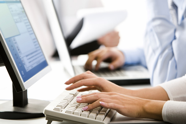 Woman typing on keyboard