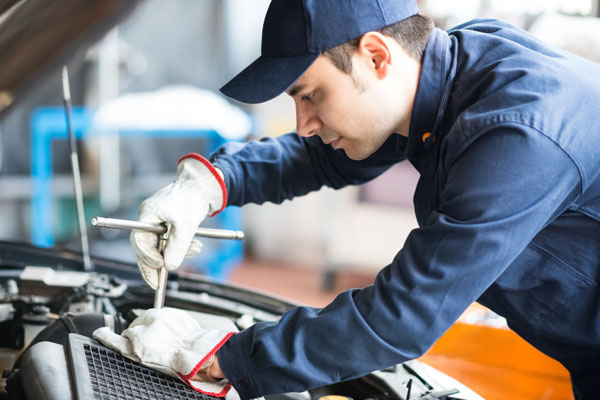 Technician working on vehicle