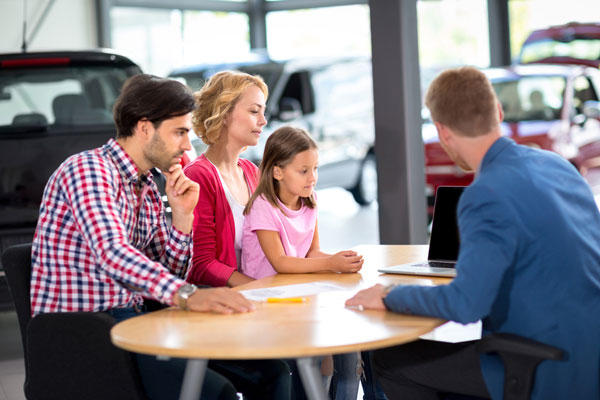 Family sitting at desk