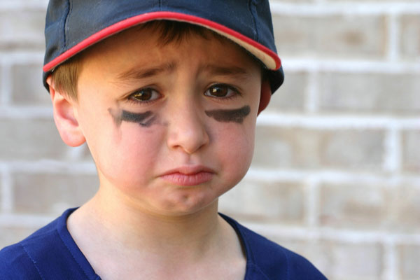 Sad young baseball player