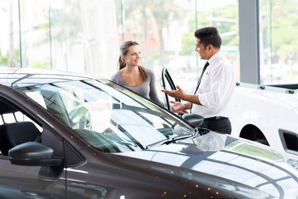 Woman looking at vehicle