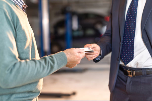 Men exchanging payment