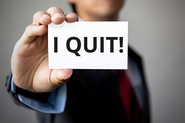 Man in suit saying "I quit!"