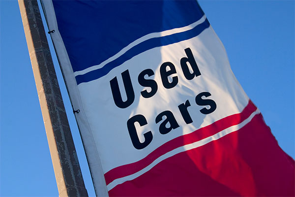 Used car flag flying in the air