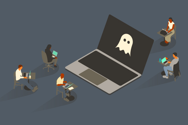 Ghost on large laptop with other smaller computer users sitting at desks nearby